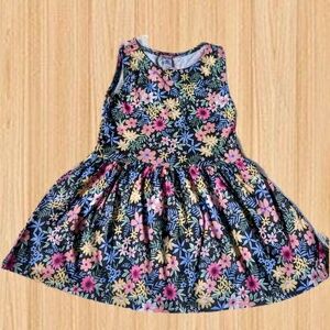 Bold Blooms: Sleeveless Floral Dress for Girls with Vibrant Colors